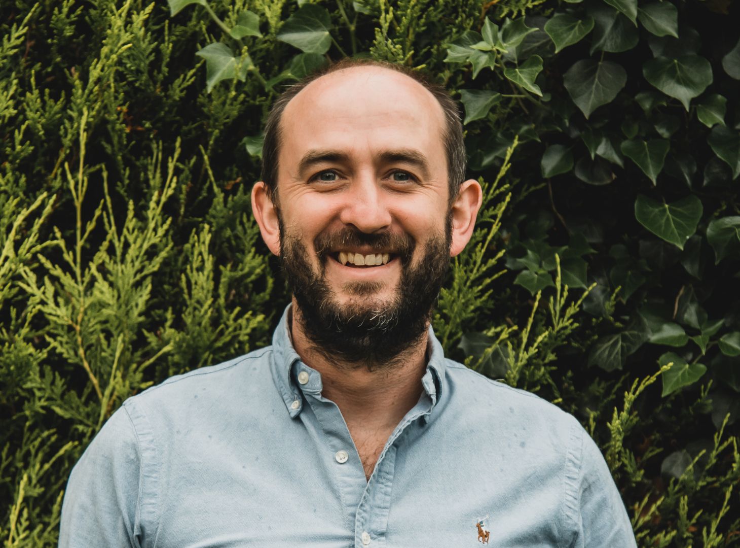 Headshot of Chris Liddle in front of trees
