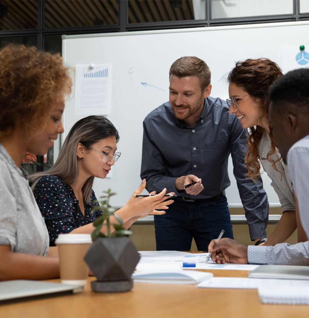 Accountants working together in a company acquisition meeting