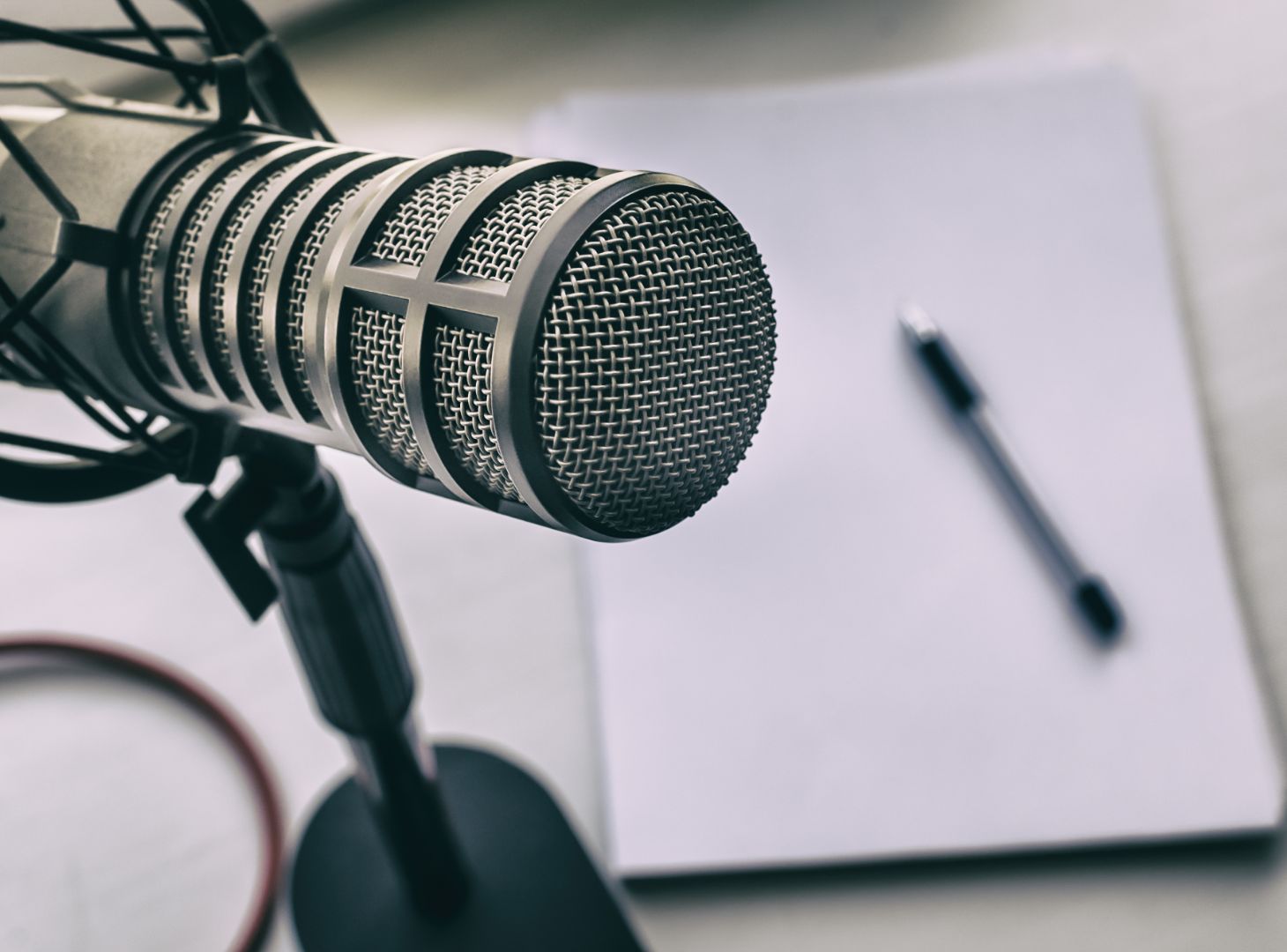 Microphone with pen and paper below it