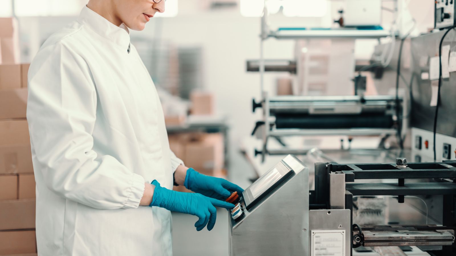 Worker operating a machine