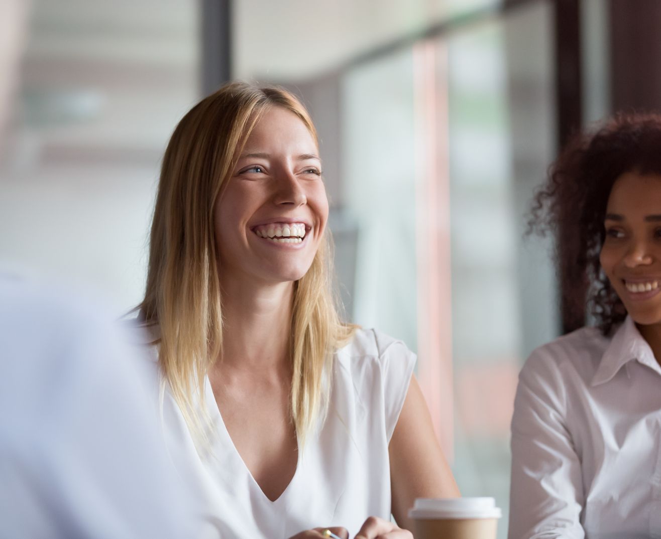 Accountants smiling during a team meeting