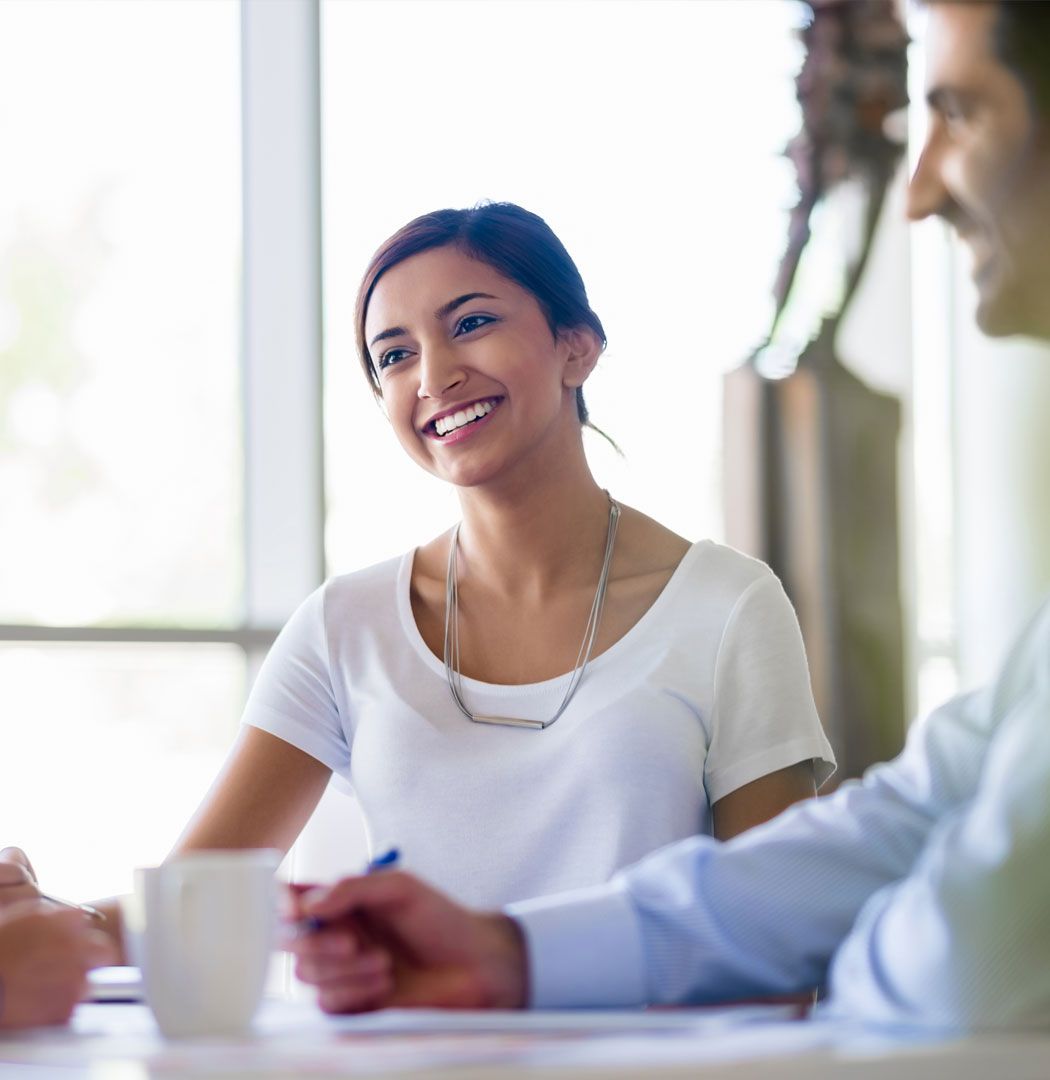 Business owner smiling during a meeting