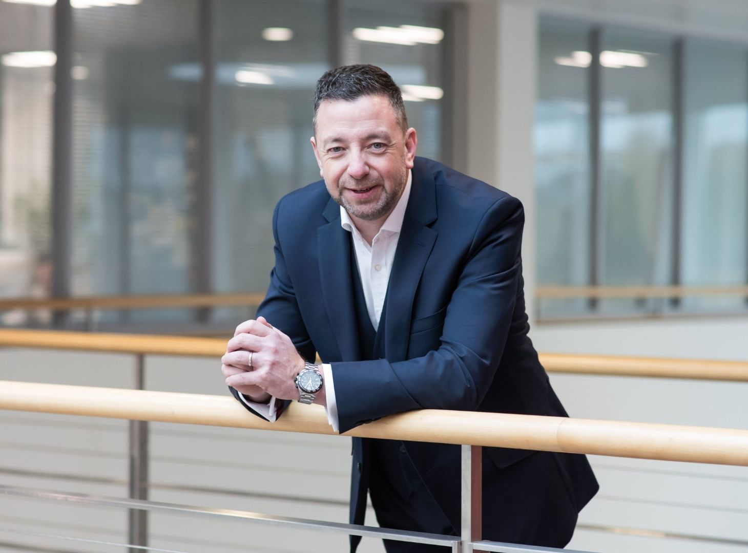 Image of Nevil Tynemouth standing next to banister