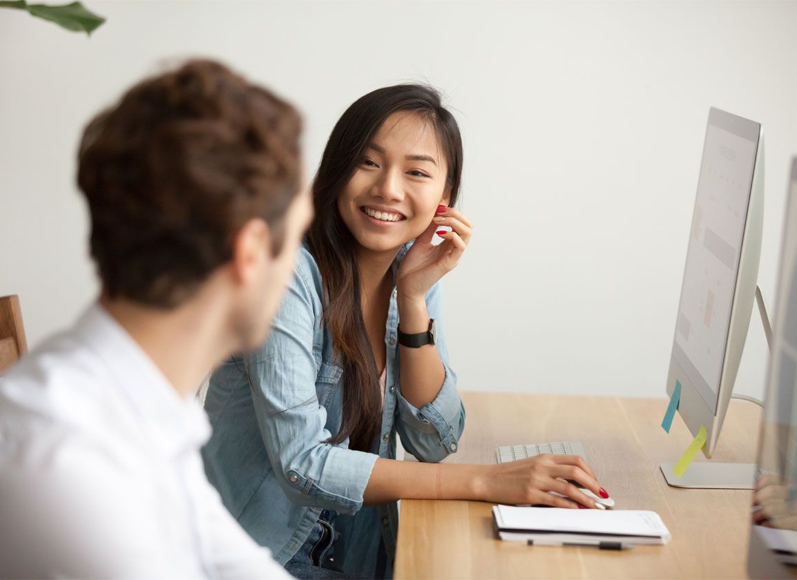 Receptionists having a conversation