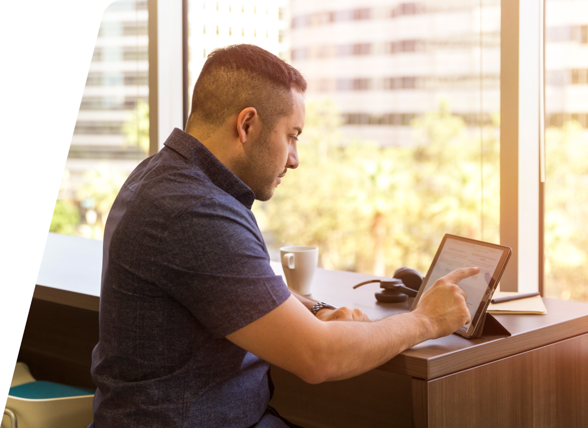 Financial Controller using a tablet in the office